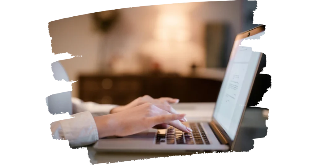 A woman hand typing in laptop – the best digital marketer in kerala